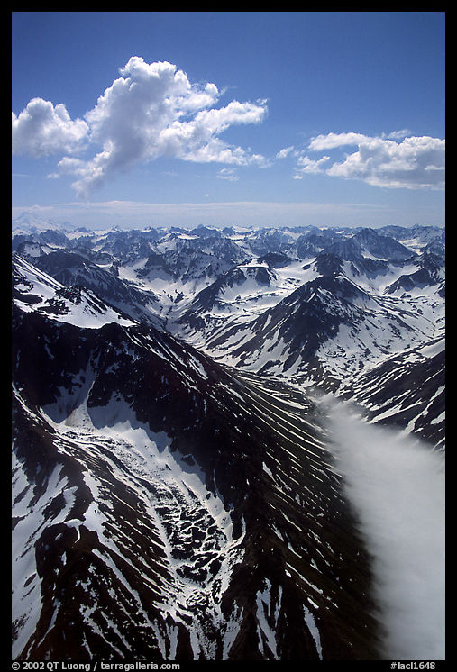 Aerial view of rocky peaks with snow, Chigmit Mountains. Lake Clark National Park, Alaska, USA.