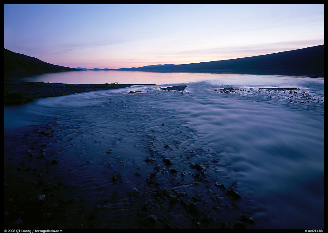 Stream flows into Turquoise Lake, midnight sunset. Lake Clark National Park, Alaska, USA.