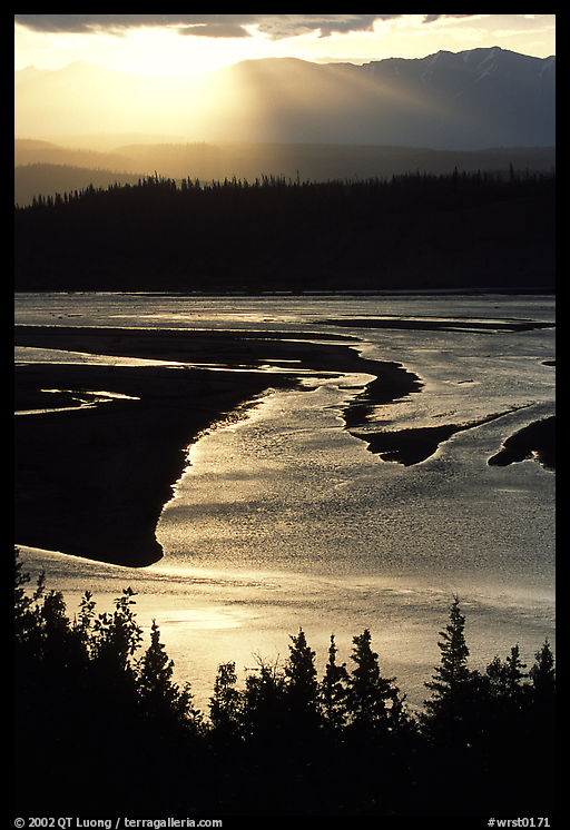Early morning sun shining on the wide Chitina river. Wrangell-St Elias National Park, Alaska, USA.