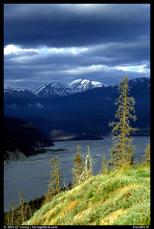 Chitina river under dark clouds. Wrangell-St Elias National Park, Alaska, USA.