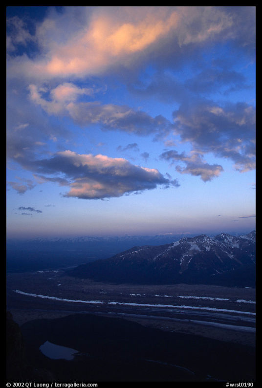 Clouds, glacier, and mountains seen from above. Wrangell-St Elias National Park, Alaska, USA.