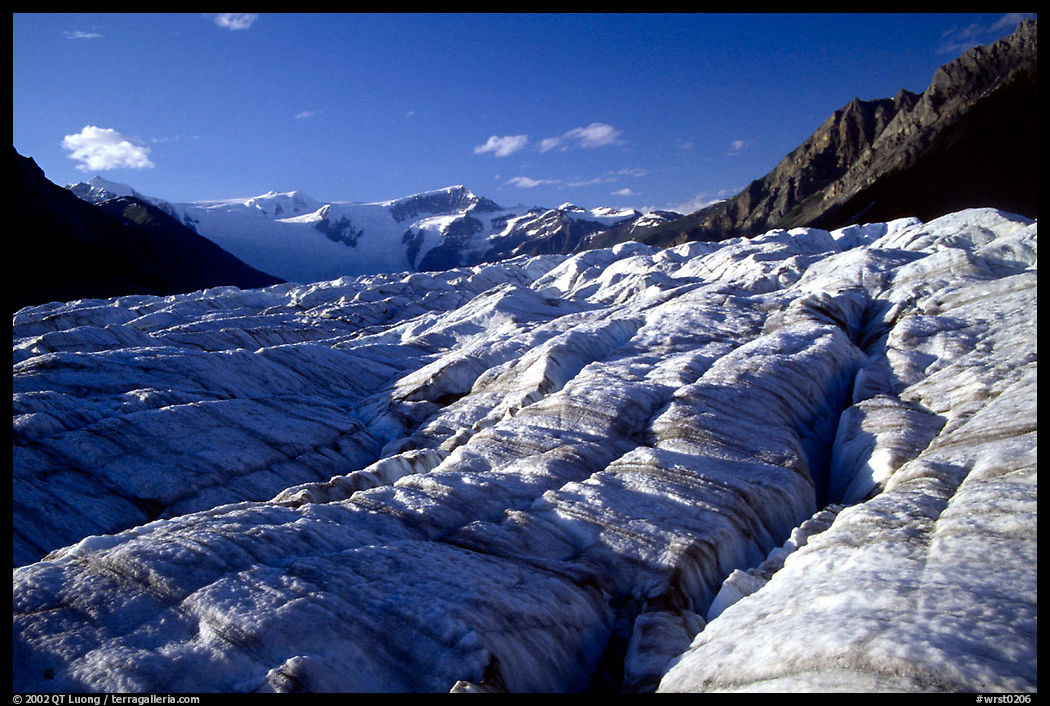 Crevasses on Root glacier, Wrangell mountains in the background, late afternoon. Wrangell-St Elias National Park, Alaska, USA.