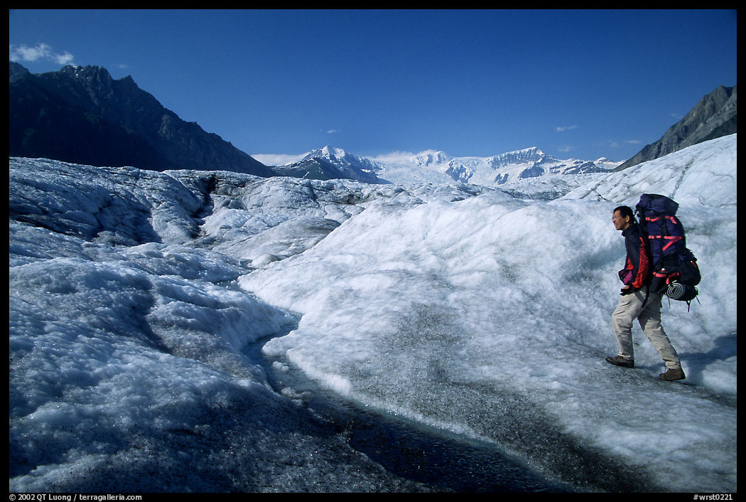 Backpacker on Root glacier. Wrangell-St Elias National Park, Alaska, USA.