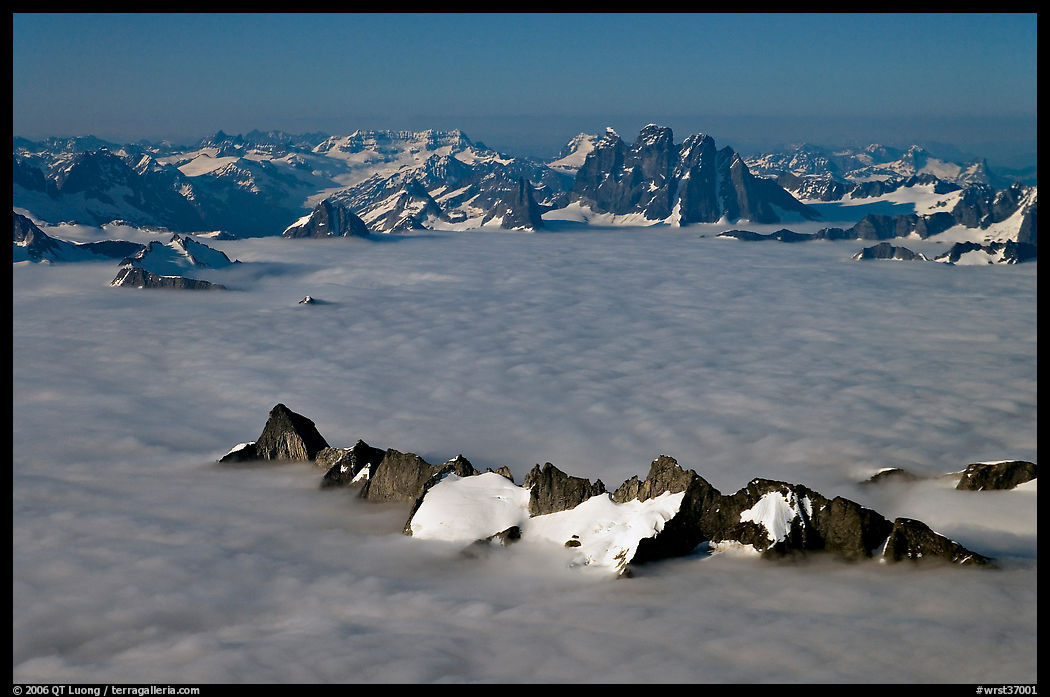 Aerial view of peaks emerging from sea of clouds, St Elias range. Wrangell-St Elias National Park, Alaska, USA.