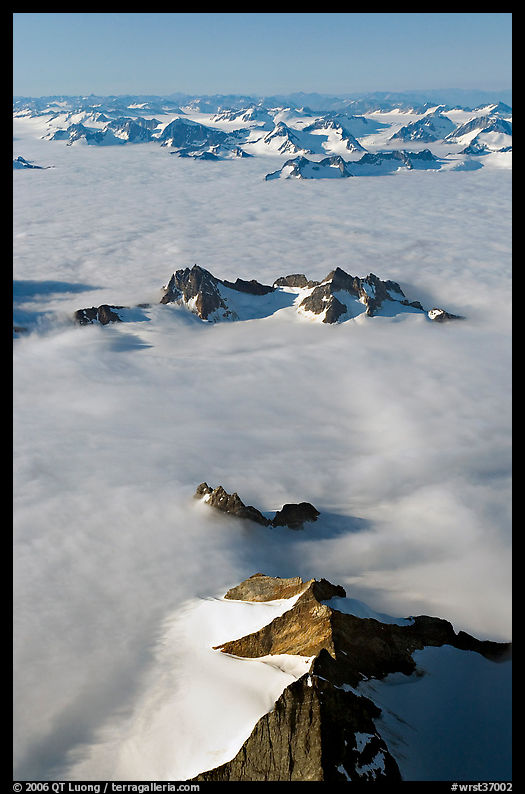 Aerial view of ridges and summits emerging from sea of clouds, St Elias range. Wrangell-St Elias National Park, Alaska, USA.