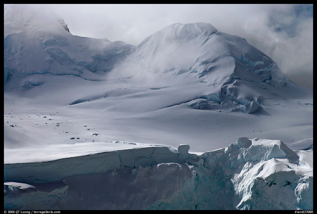 Aerial view of seracs and snowy peak, University Range. Wrangell-St Elias National Park, Alaska, USA.