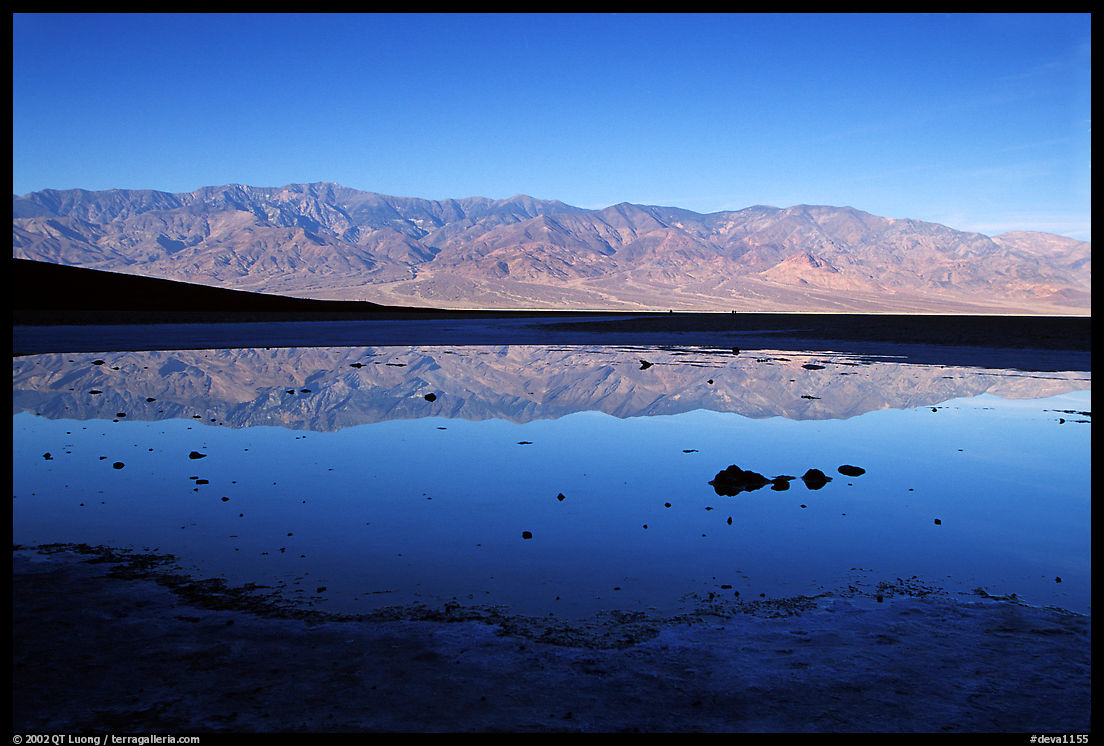 Panamint range reflexion in Badwater pond, early morning. Death Valley National Park, California, USA.