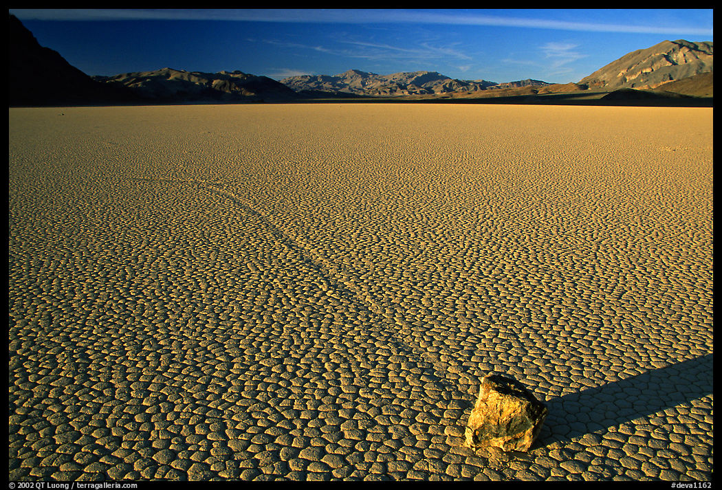 Tracks, moving rock on the Racetrack, late afternoon. Death Valley National Park, California, USA.