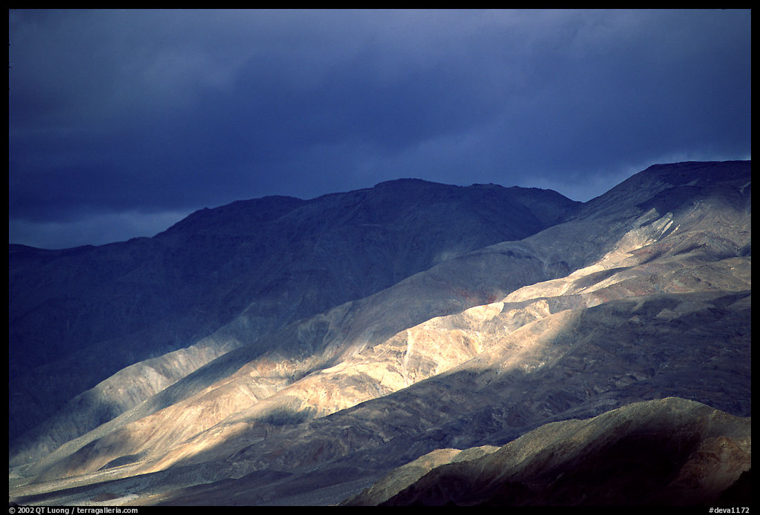 Storm light on foothills. Death Valley National Park, California, USA.