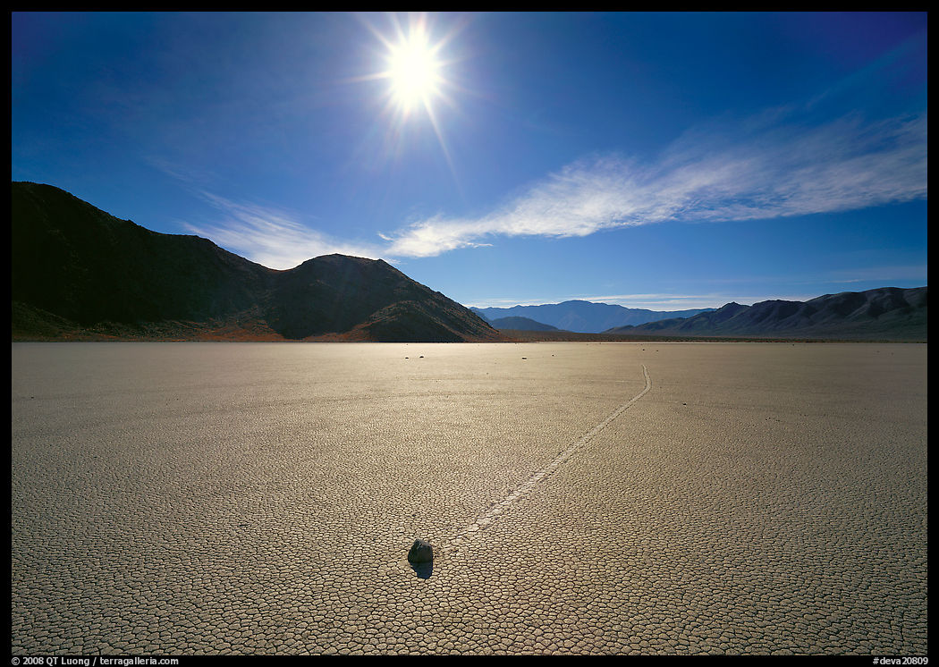 Sun and moving rock on the Racetrack, mid-day. Death Valley National Park, California, USA.
