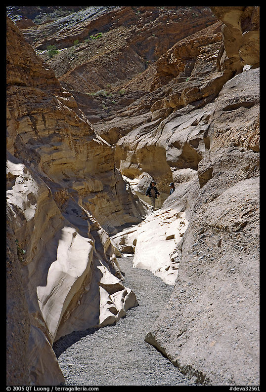 Hikers in slot, Mosaic canyon. Death Valley National Park, California, USA.
