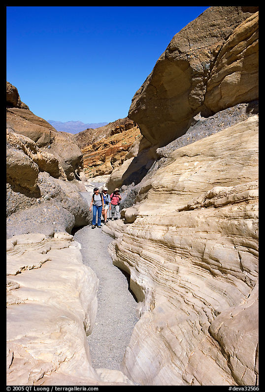 Hikers in narrows, Mosaic canyon. Death Valley National Park, California, USA.
