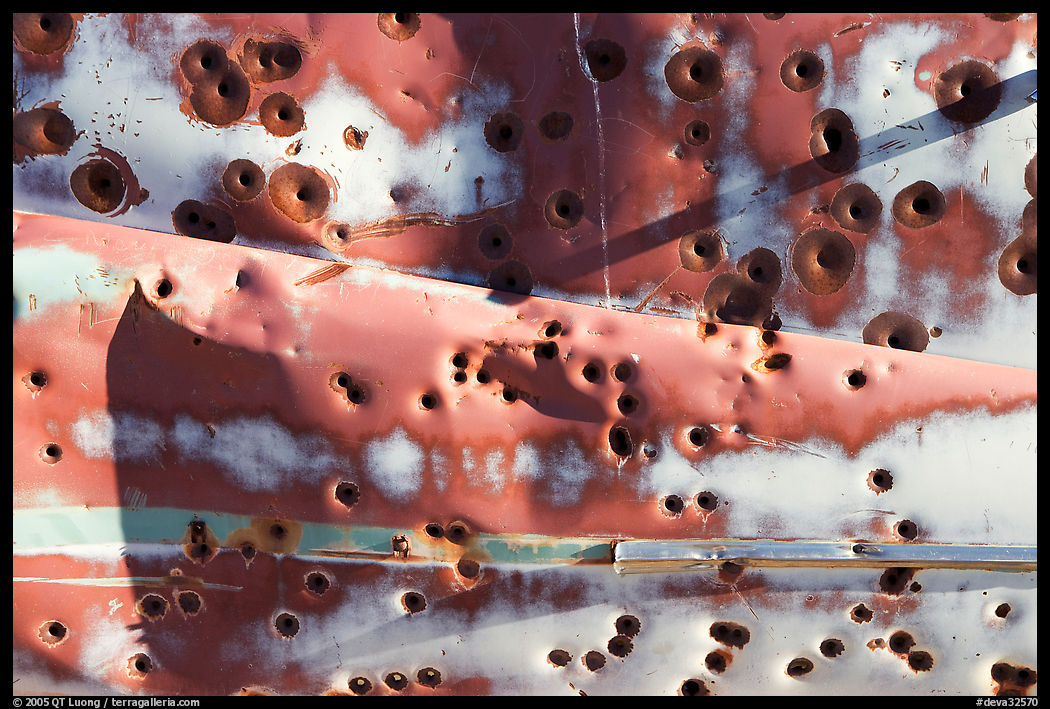 Detail of car with bullet holes near Aguereberry camp, afternoon. Death Valley National Park, California, USA.