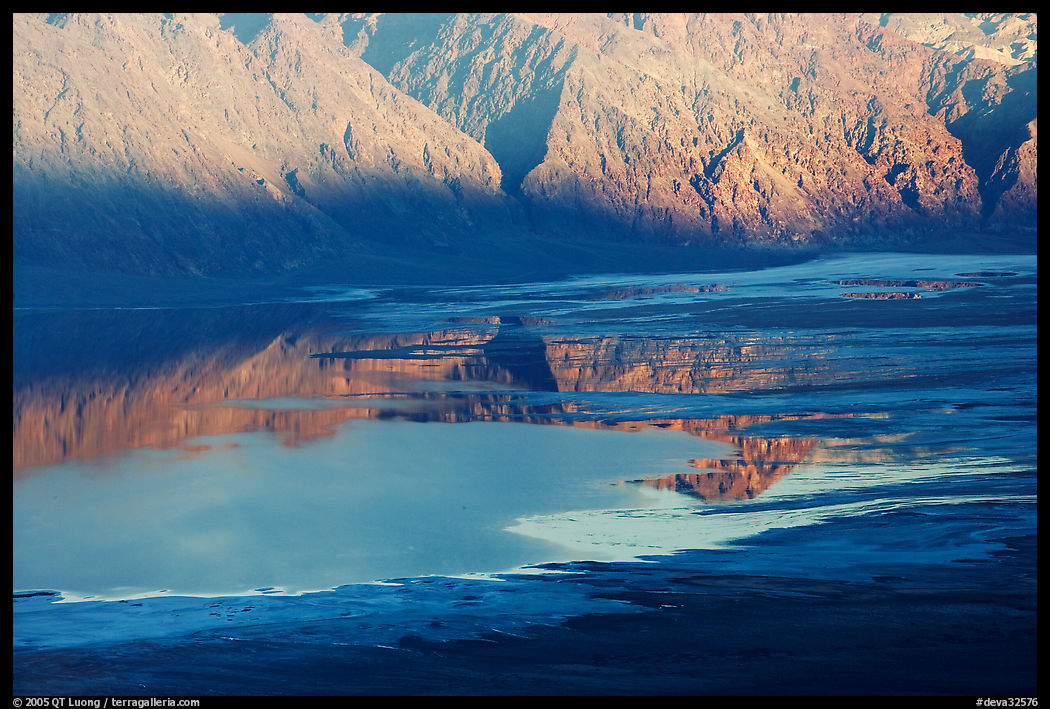 Reflexions in Manly Lake at Badwater, seen from Aguereberry point, late afternoon. Death Valley National Park, California, USA.