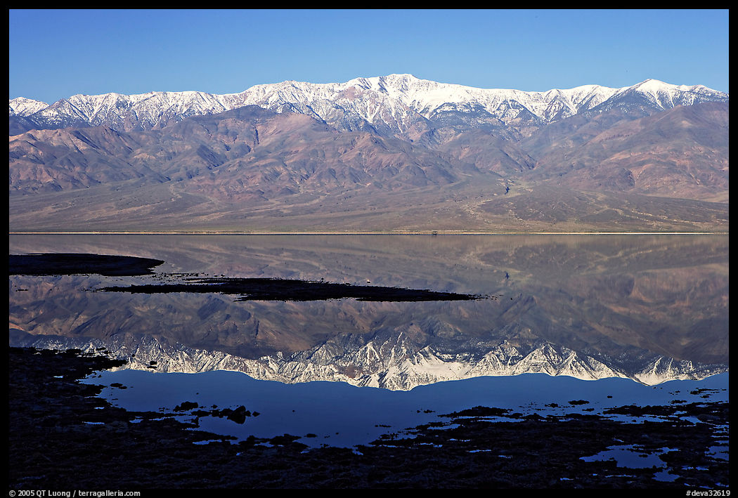 Telescope Peak and Panamint range reflected in a rare seasonal lake, early morning. Death Valley National Park, California, USA.