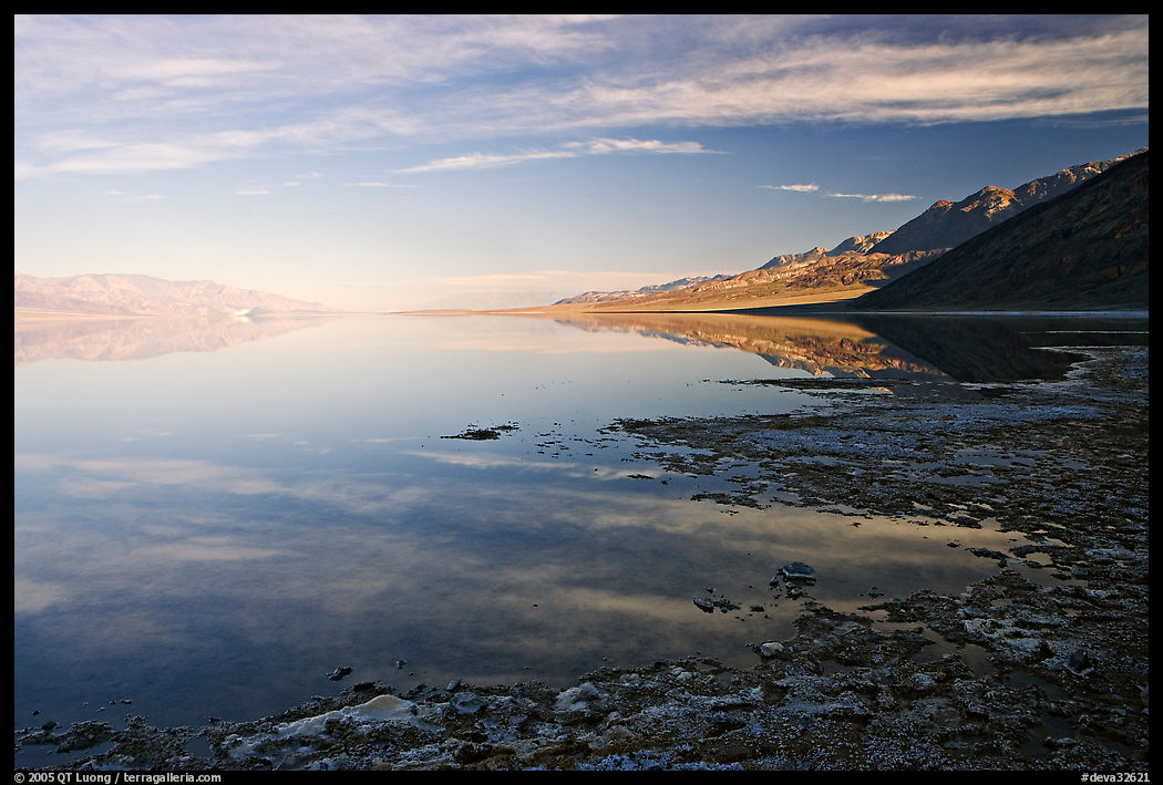 Flooded Badwater basin and Black mountain reflections, early morning. Death Valley National Park, California, USA.