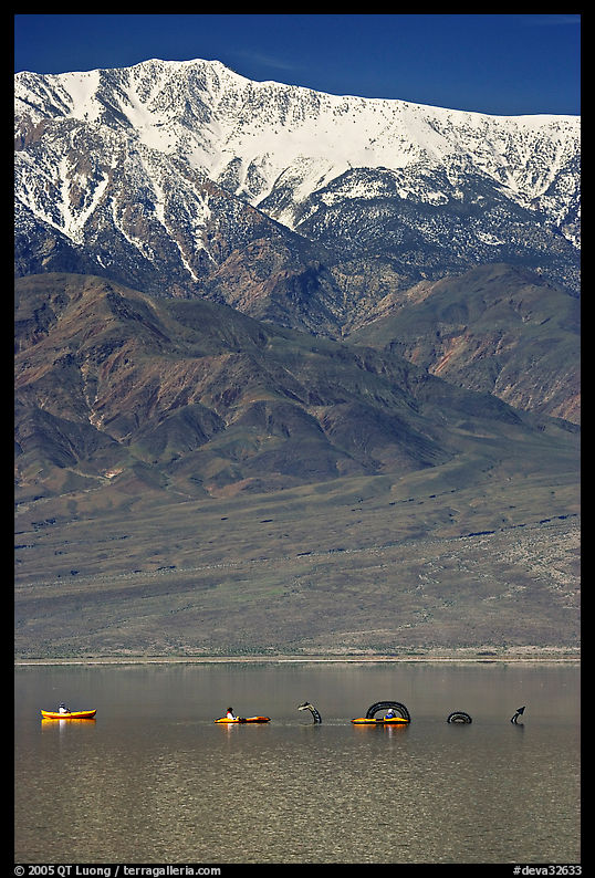 Kayakers near the Loch Ness Monster in Manly Lake, below Telescope Peak. Death Valley National Park, California, USA.