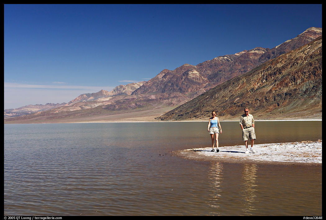 Couple on the shores of Manly Lake. Death Valley National Park, California, USA.