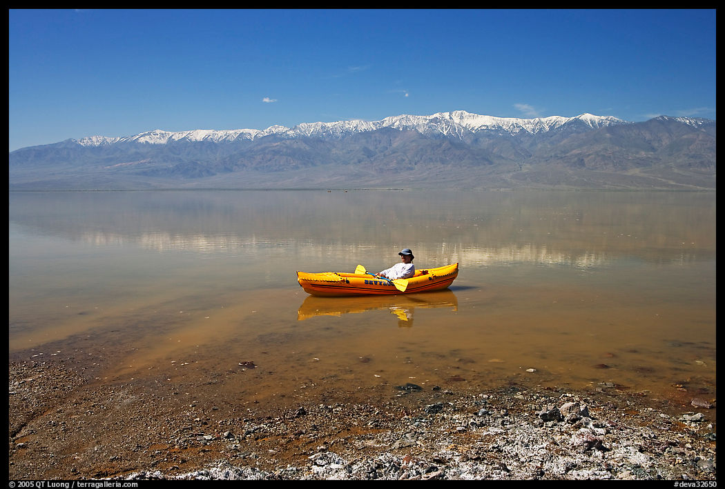 Kayaker near shore in Manly Lake. Death Valley National Park, California, USA.
