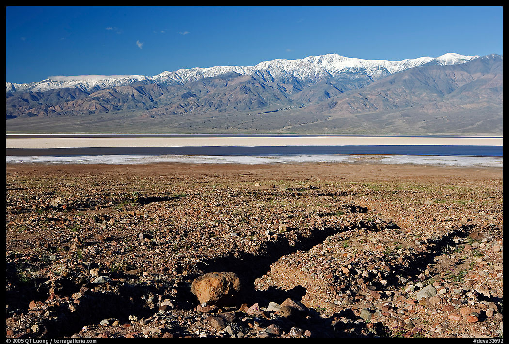 Valley with seasonal lake in the distance and Panamint Range, morning. Death Valley National Park, California, USA.