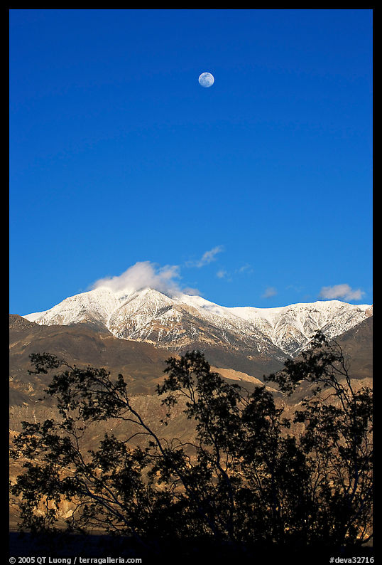Moon and Panamint Range seen from the West. Death Valley National Park, California, USA.
