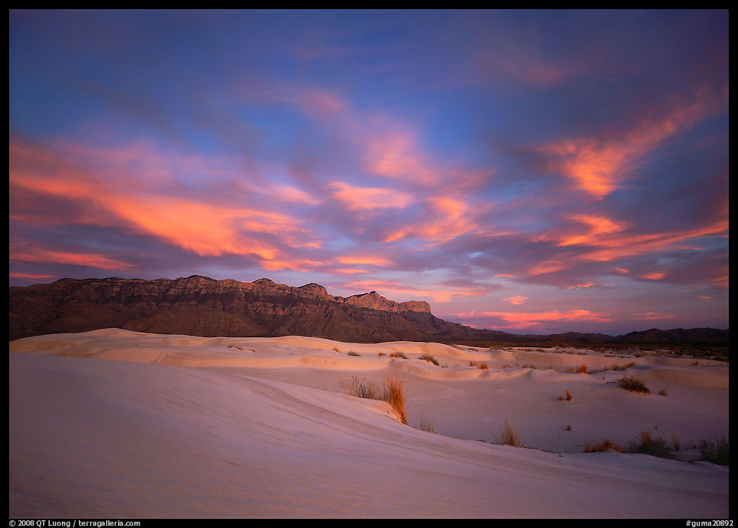 White sand dunes, Guadalupe range, and clouds at sunset. Guadalupe Mountains National Park, Texas, USA.