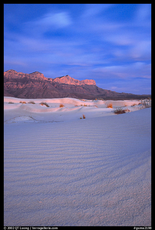 Gypsum sand dunes and Guadalupe range at sunset. Guadalupe Mountains National Park