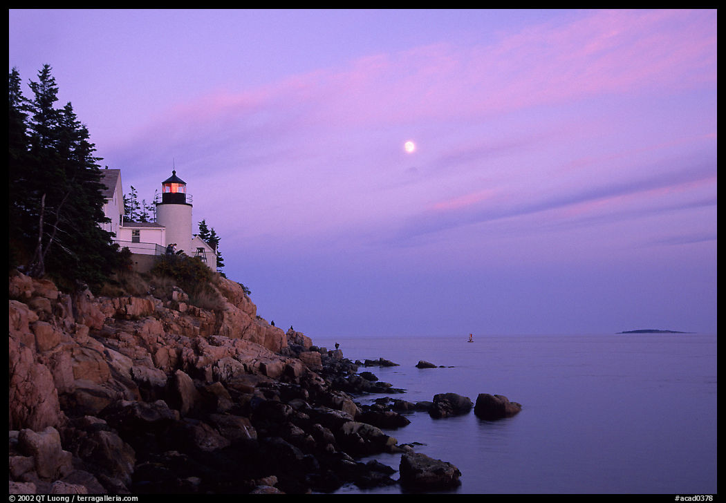 Bass Harbor lighthouse on rocky coast, sunset. Acadia National Park, Maine, USA.