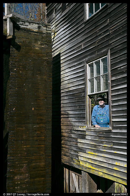 Miller standing at window, Mingus Mill, North Carolina. Great Smoky Mountains National Park, USA.