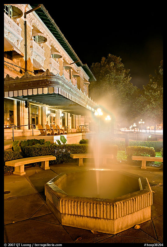 Fountain with thermal steam outside Fordyce Bath at night. Hot Springs  National Park, Arkansas, USA.