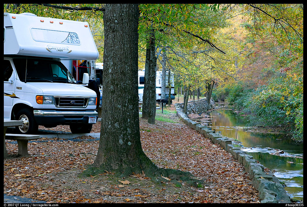 RV, trees in fall colors, and stream. Hot Springs  National Park, Arkansas, USA.