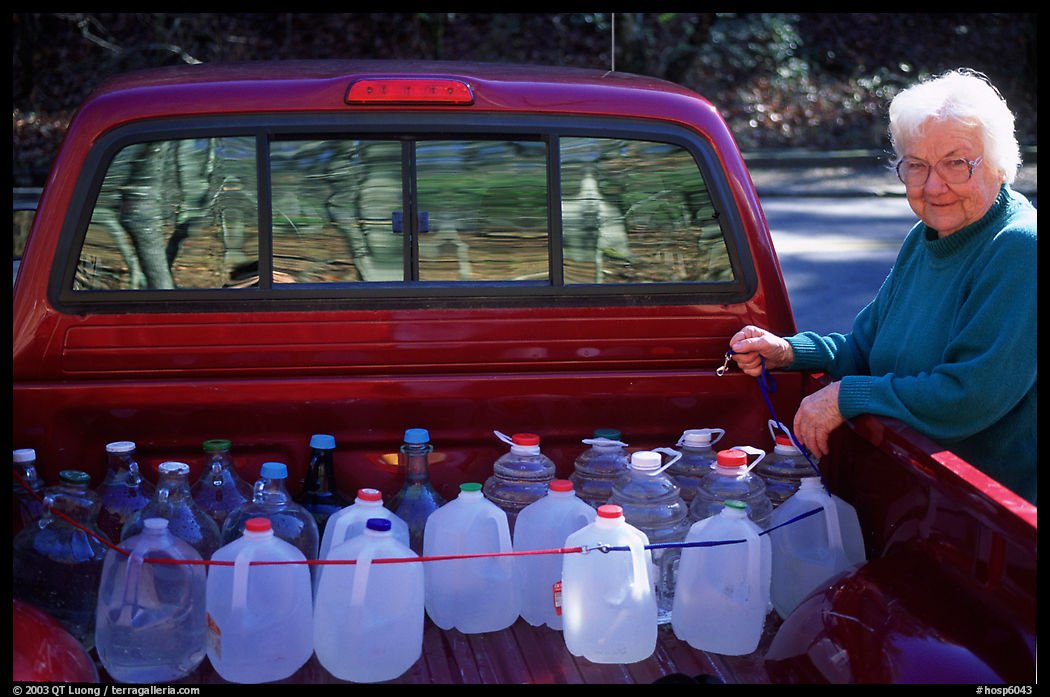 Resident stocks up on natural spring water. Hot Springs  National Park, Arkansas, USA.
