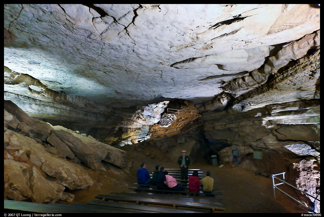 Visitors listening at ranger in large room inside cave. Mammoth Cave National Park, Kentucky, USA.
