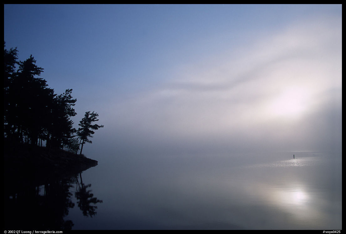 Sunrise and morning fog, Kabetogama lake near Woodenfrog. Voyageurs National Park, Minnesota, USA.