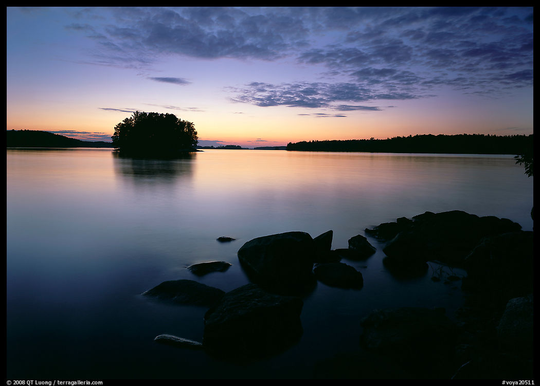 Kabetogama lake sunset with eroded granite and tree-covered islet. Voyageurs National Park, Minnesota, USA.
