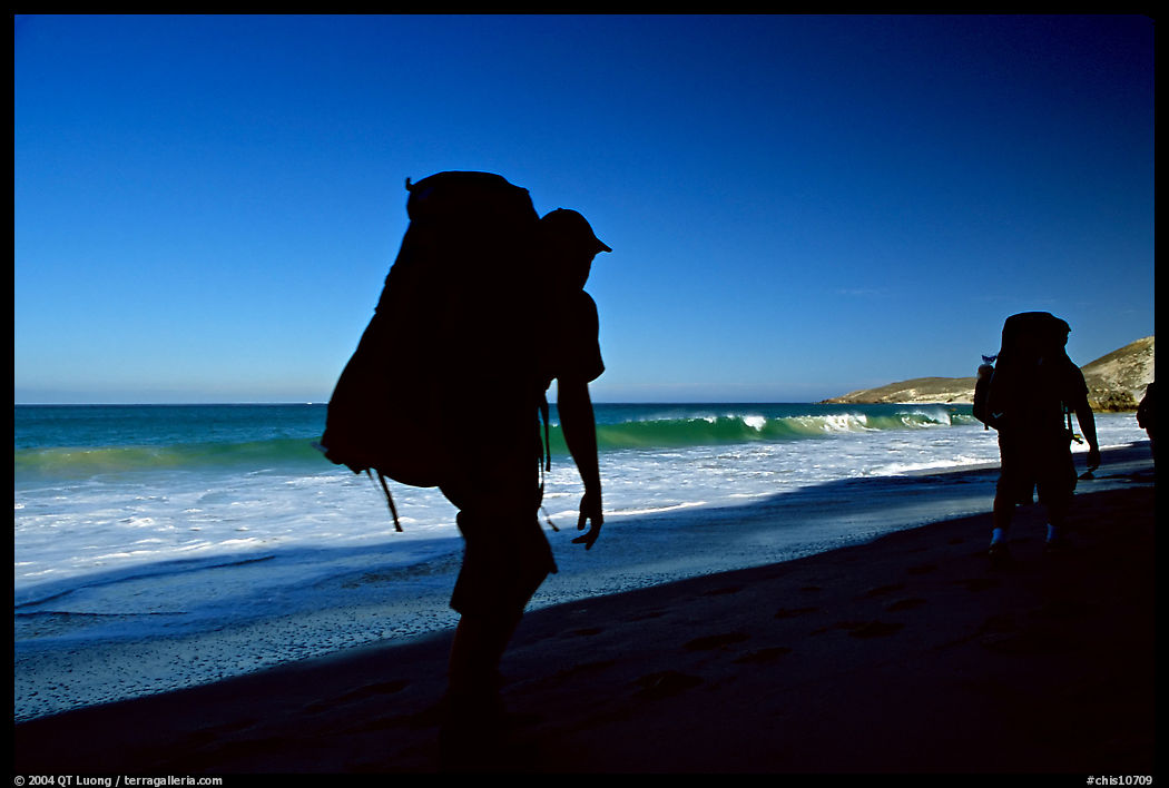 Backpackers on beach, Cuyler harbor, San Miguel Island. Channel Islands National Park, California, USA.