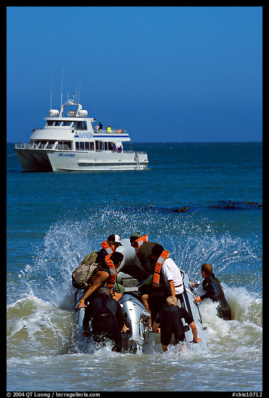Skiff crossing  surf to join tour boat, Cuyler harbor, San Miguel Island. Channel Islands National Park, California, USA.