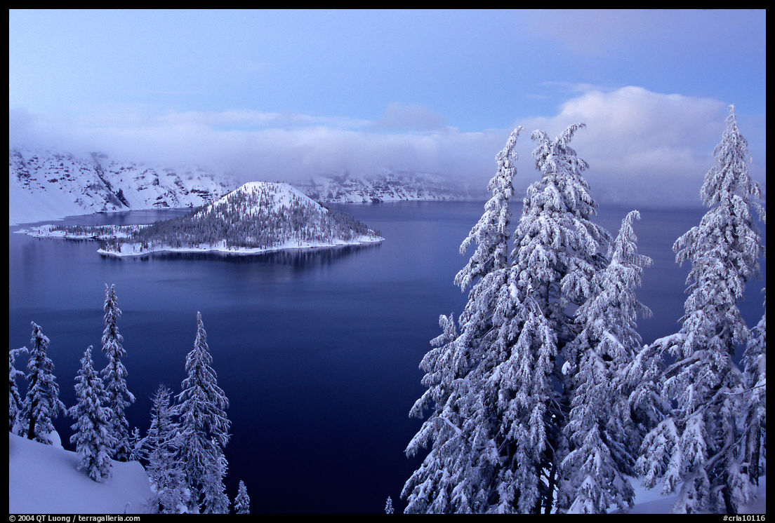 Wizard Island and Lake at dusk in winter. Crater Lake National Park, Oregon, USA.