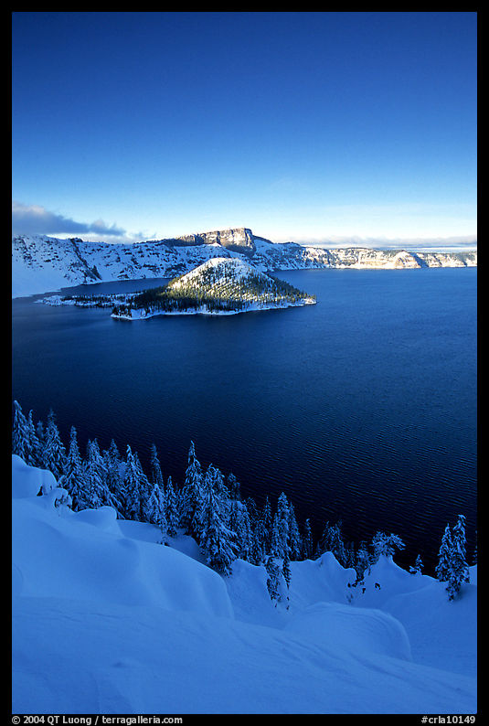Wizard Island and lake in winter, late afternoon. Crater Lake National Park, Oregon, USA.
