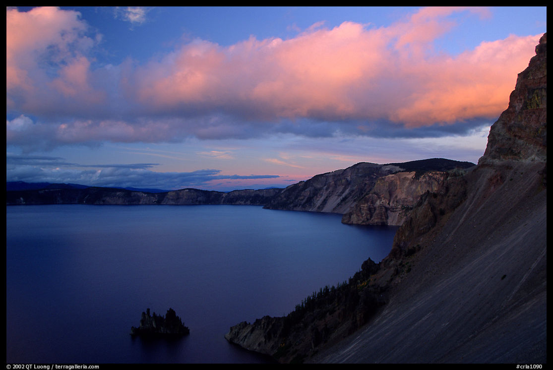 Phantom ship and lake seen from Sun Notch, sunset. Crater Lake National Park, Oregon, USA.