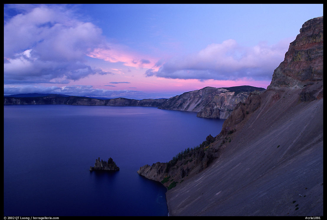 Phantom ship and lake seen from Sun Notch, sunset. Crater Lake National Park, Oregon, USA.