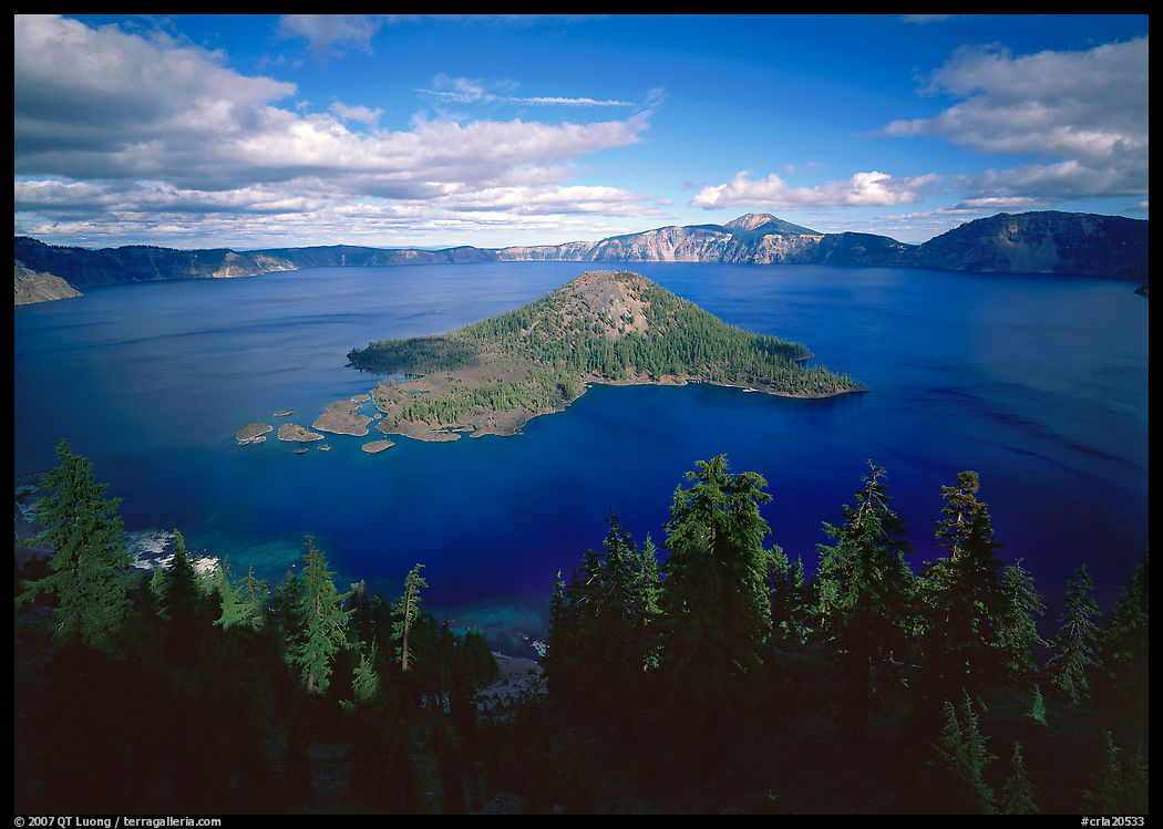 Wide view of lake with Wizard Island, afternoon. Crater Lake National Park, Oregon, USA.