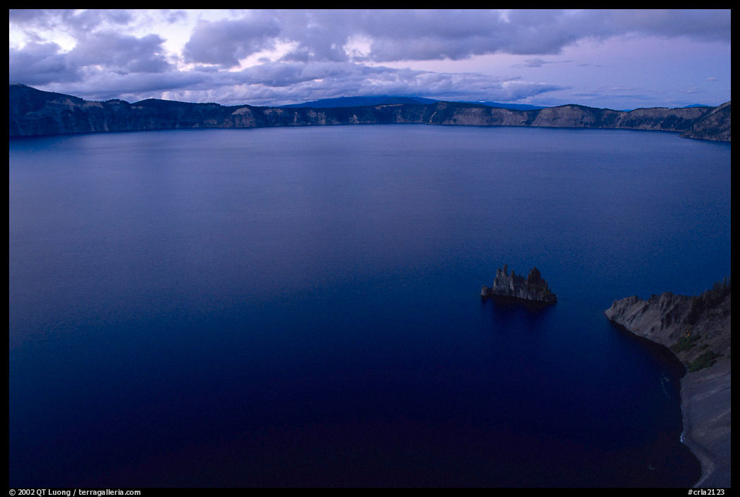 Phantom ship and lake seen from Sun Notch, dusk. Crater Lake National Park, Oregon, USA.