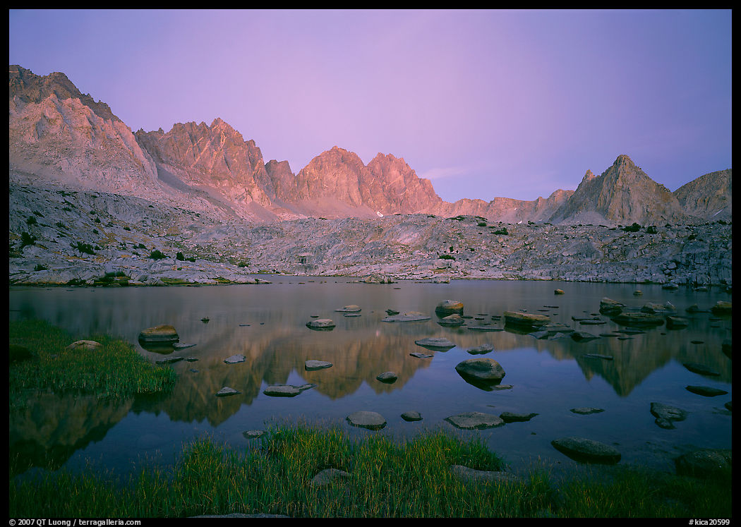 Mt Agasiz, Mt Thunderbolt, and Isoceles Peak reflected in a lake in Dusy Basin, sunset. Kings Canyon  National Park, California, USA.