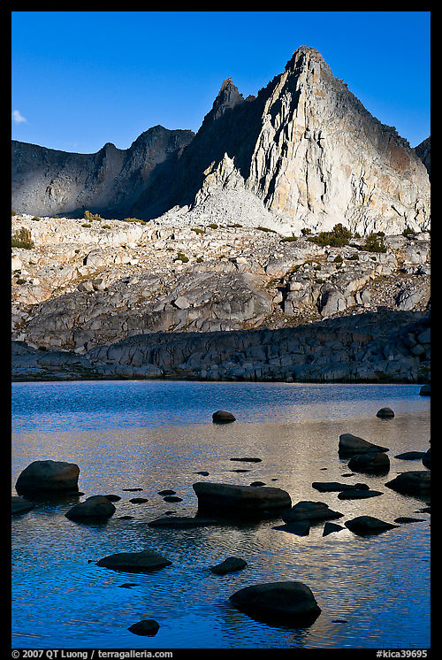 Isocele Peak reflected in lake, late afternoon, Dusy Basin. Kings Canyon  National Park, California, USA.