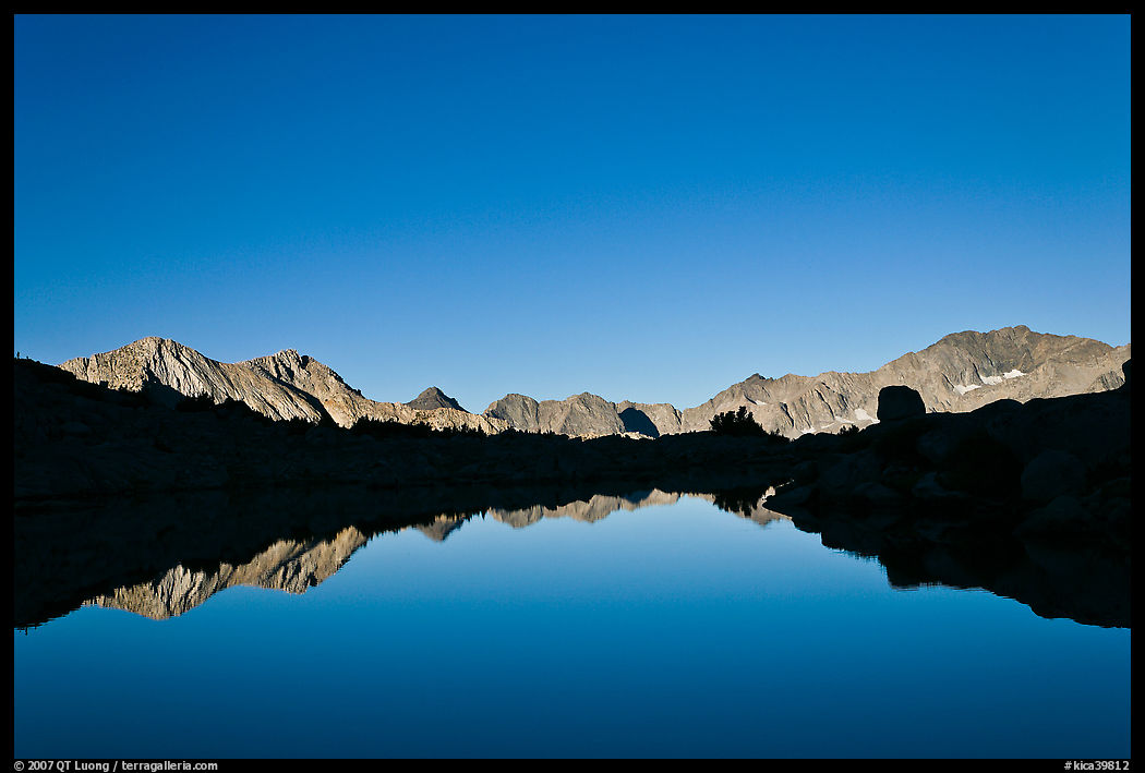 Mountain range reflected in calm lake, Dusy Basin. Kings Canyon  National Park, California, USA.