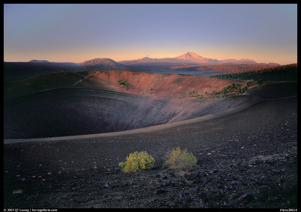 Sagebrush bushes, Cinder cone rim, and Lassen Peak, sunrise. Lassen Volcanic National Park, California, USA.