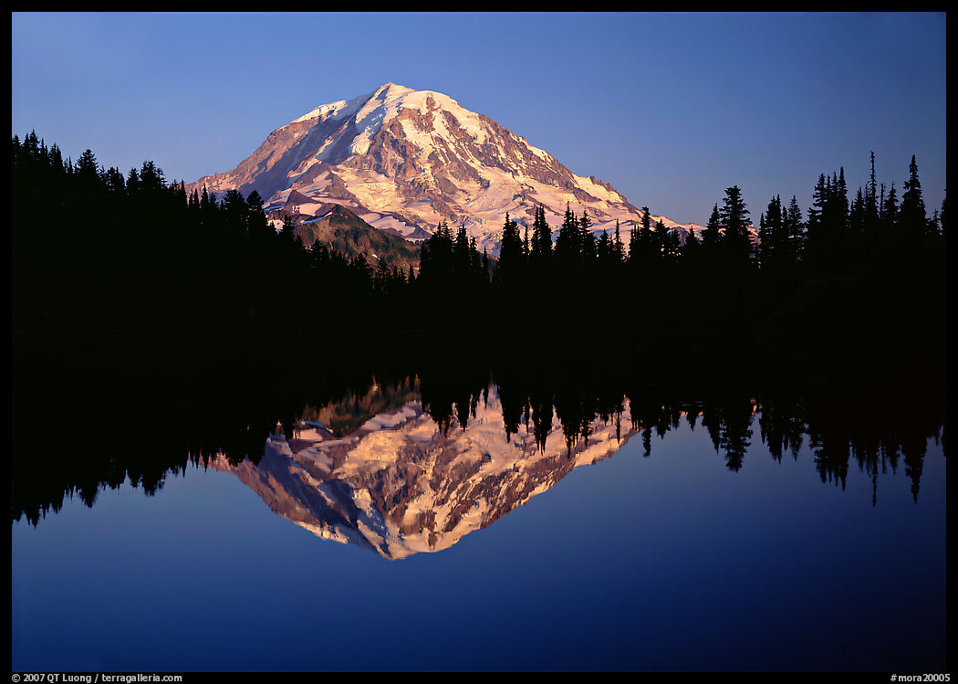 Mount Rainier with calm reflection in Eunice Lake, sunset. Mount Rainier National Park