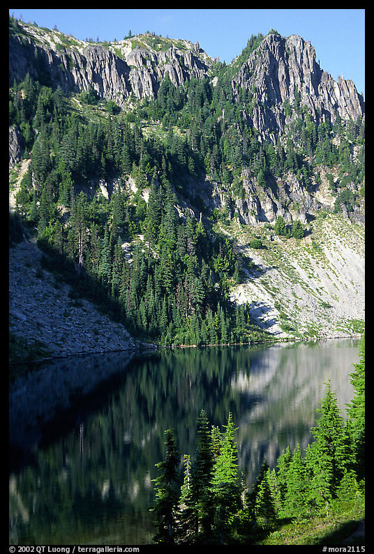 Cliffs reflected in Eunice Lake. Mount Rainier National Park, Washington, USA.