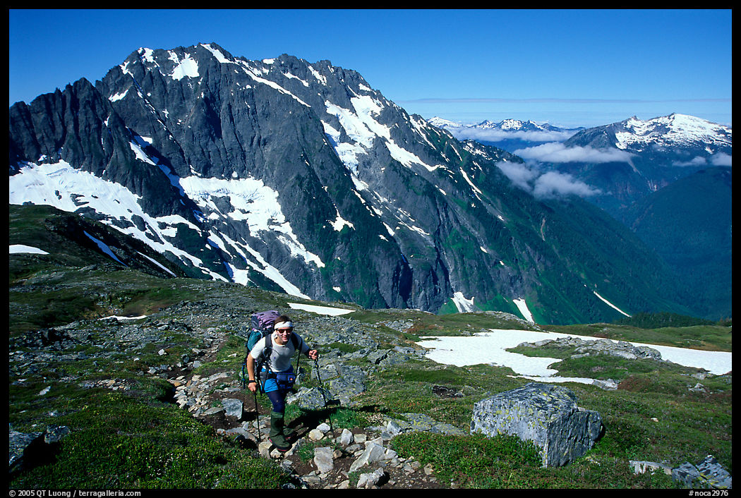 Mountaineer hiking on the way to Sahale Peak. North Cascades National Park, Washington, USA.